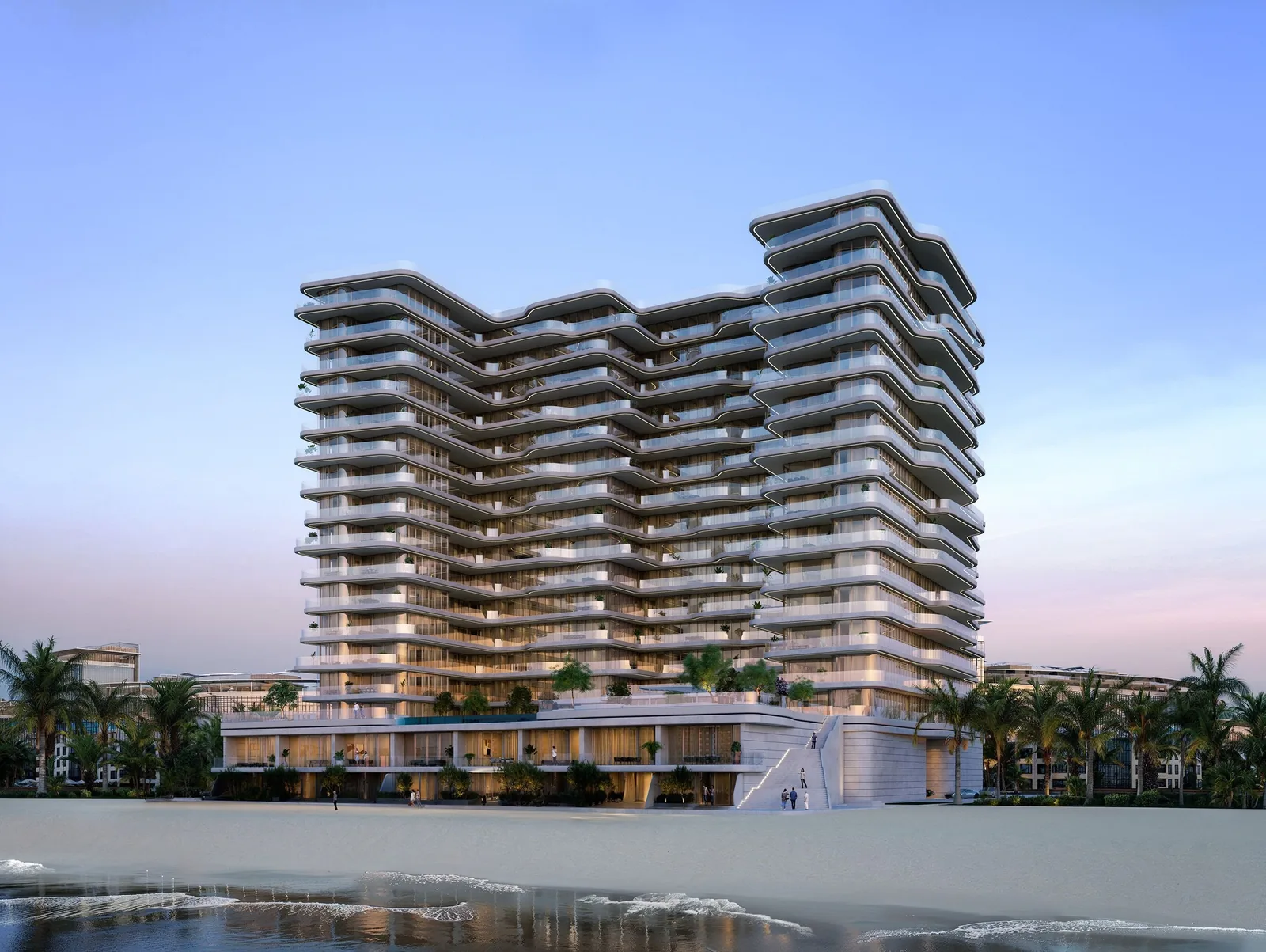 Contemporary multi-story white residential tower with wavy sculpted balconies, fronted by a sandy beach, palm trees, and a shallow tide under a soft blue and pink dusk sky.